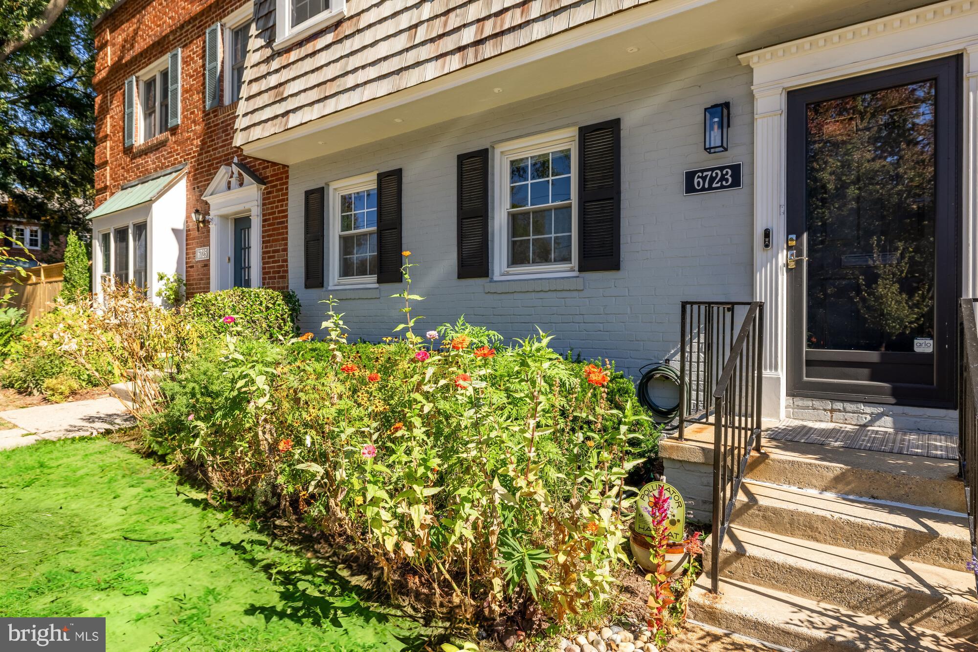 6723 Fairfax Road, Unit 15 Chevy Chase, MD 20815 - Photo 2 of 43 a front view of a house with garden