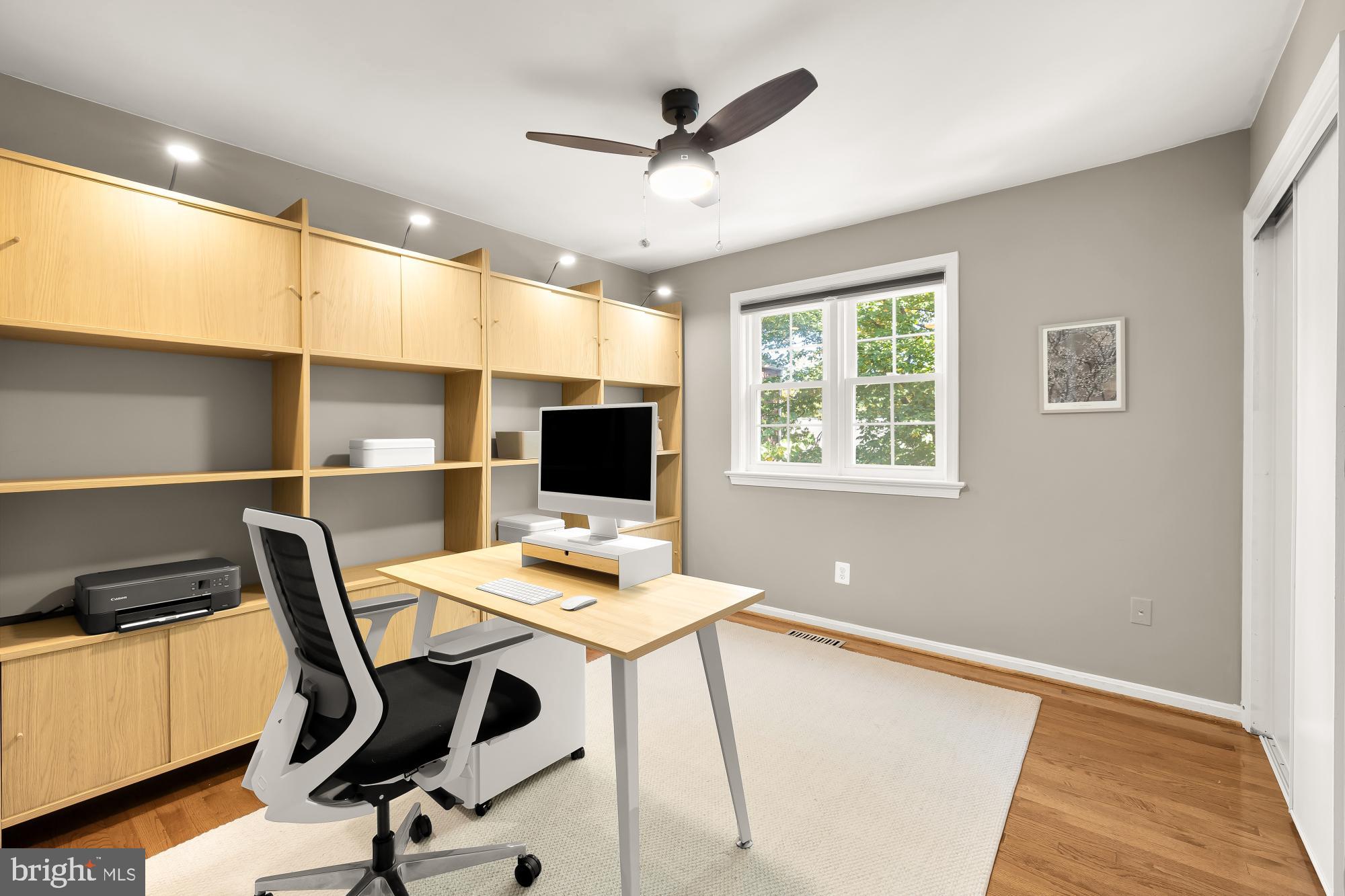 6723 Fairfax Road, Unit 15 Chevy Chase, MD 20815 - Photo 24 of 43 a workspace with furniture hardwood and a window