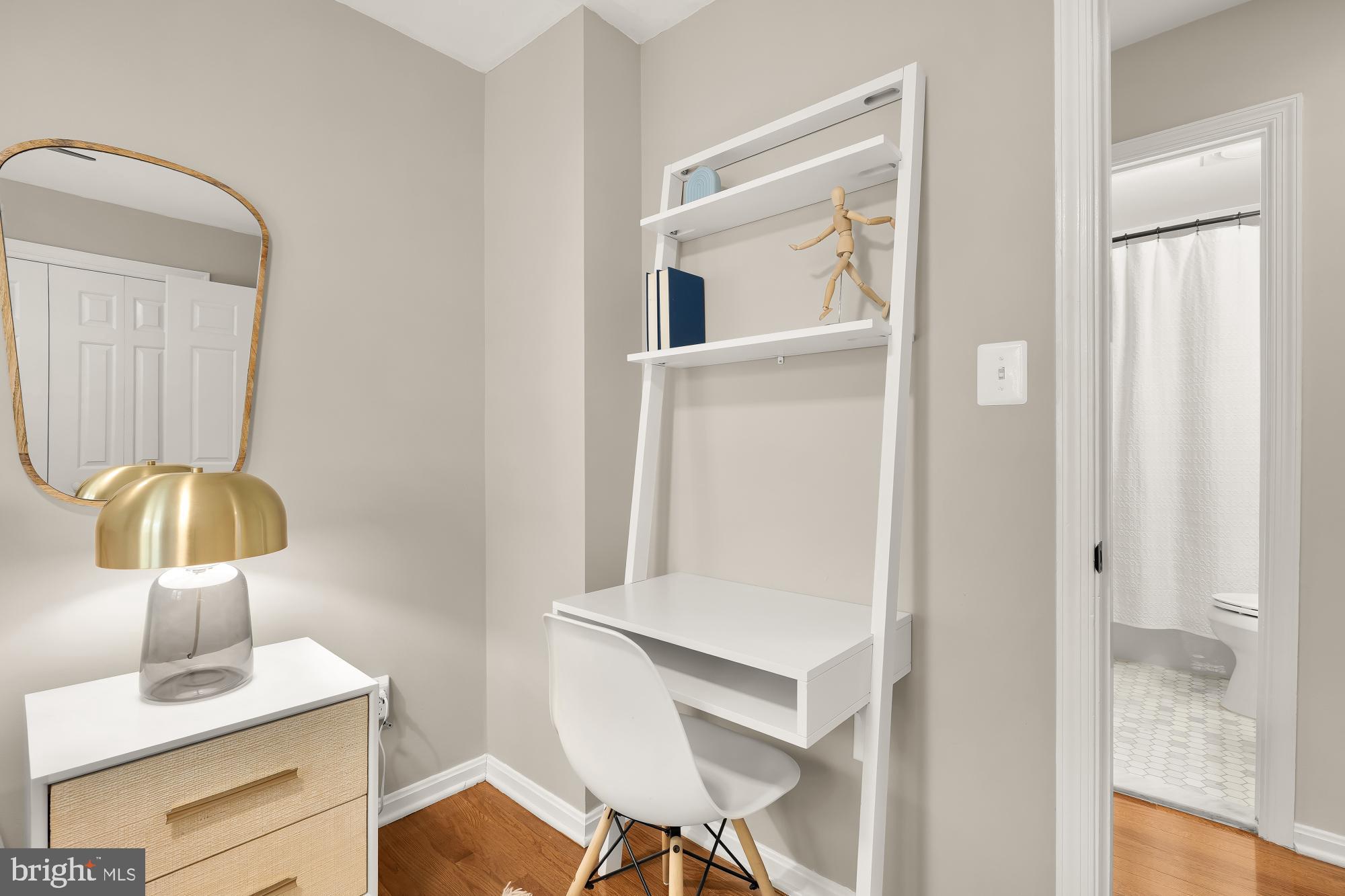 6723 Fairfax Road, Unit 15 Chevy Chase, MD 20815 - Photo 28 of 43 a bathroom with a sink and a mirror