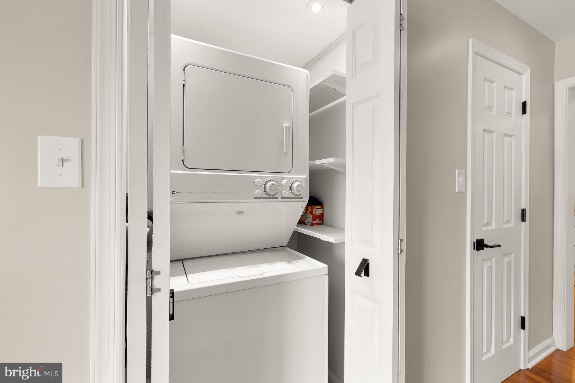 6723 Fairfax Road, Unit 15 Chevy Chase, MD 20815 - Photo 29 of 43 a utility room with dryer and washer