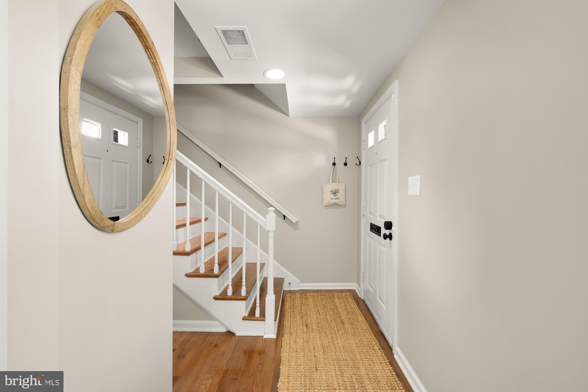 6723 Fairfax Road, Unit 15 Chevy Chase, MD 20815 - Photo 3 of 43 an entryway in wooden floor with a living room