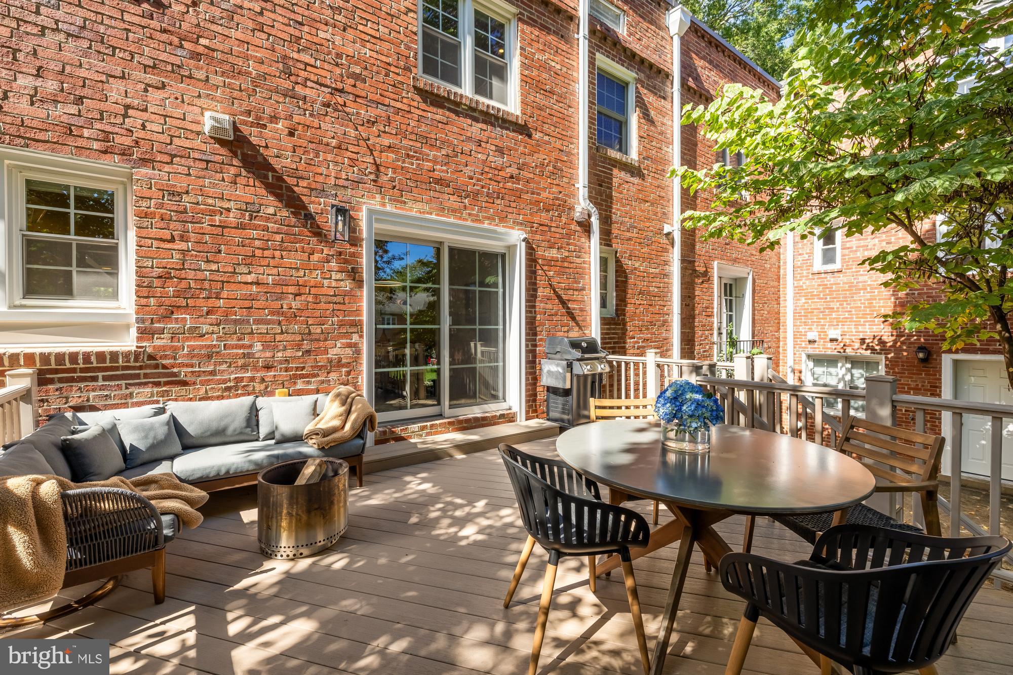 6723 Fairfax Road, Unit 15 Chevy Chase, MD 20815 - Photo 33 of 43 a view of a patio with a table and chairs