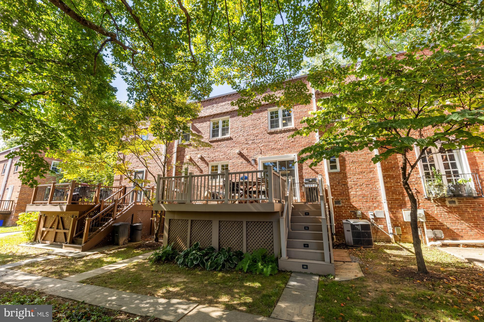 6723 Fairfax Road, Unit 15 Chevy Chase, MD 20815 - Photo 34 of 43 a view of a house with a tree in front