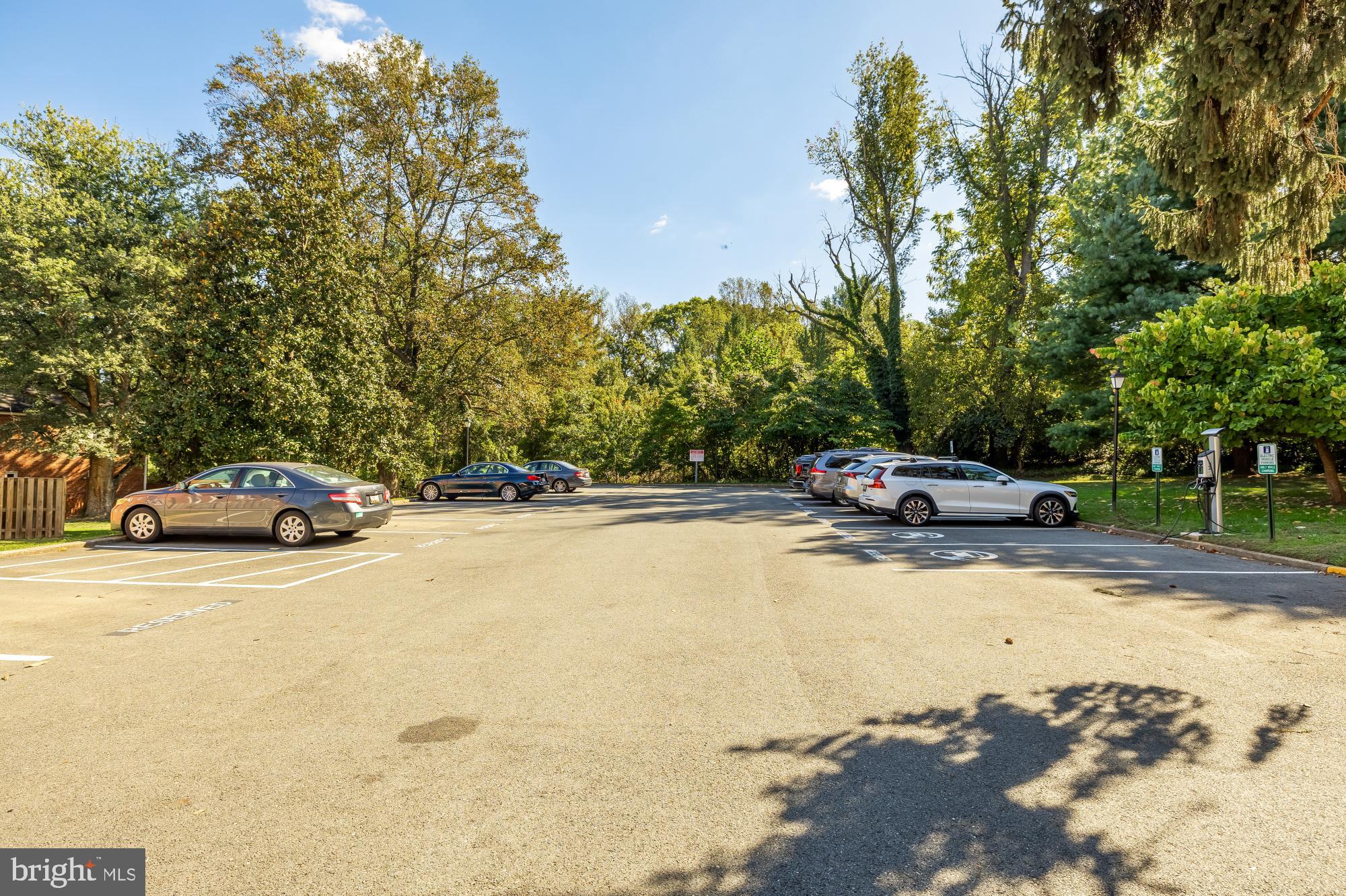 6723 Fairfax Road, Unit 15 Chevy Chase, MD 20815 - Photo 39 of 43 a car parked on the side of a street