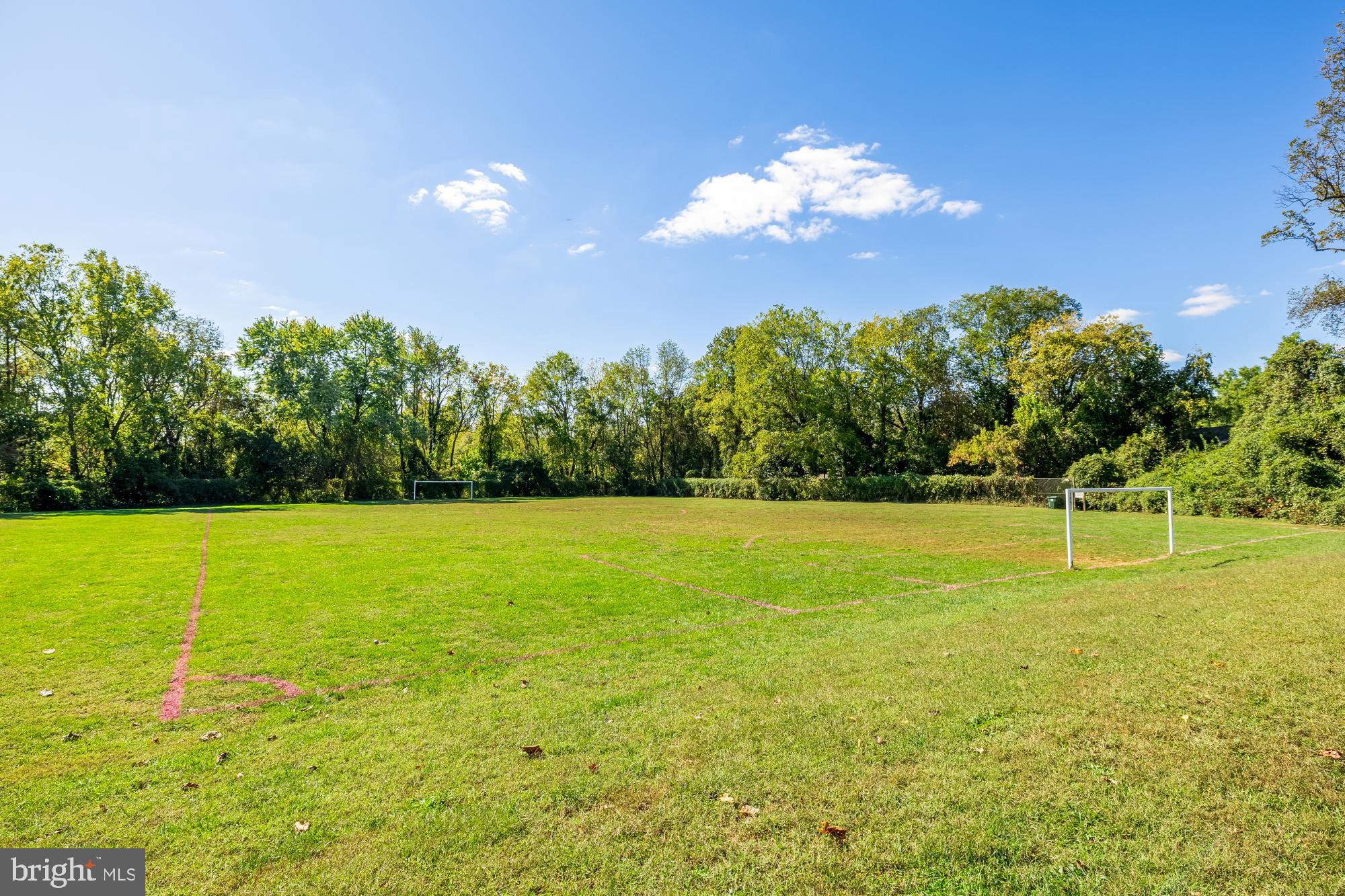 6723 Fairfax Road, Unit 15 Chevy Chase, MD 20815 - Photo 41 of 43 a view of a swimming pool with an outdoor space and seating area