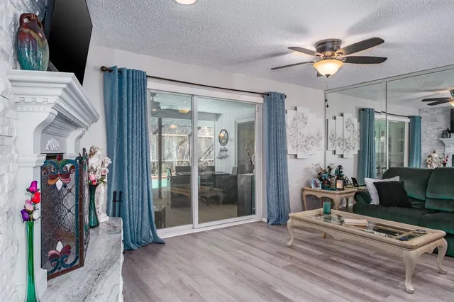 a view of a dining room with furniture wooden floor and chandelier