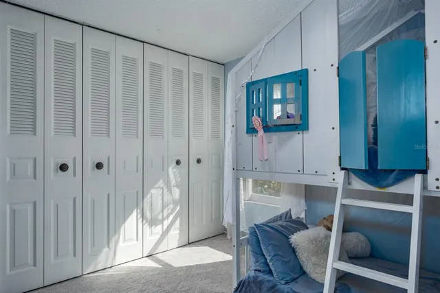 swimming pool view with a garden space