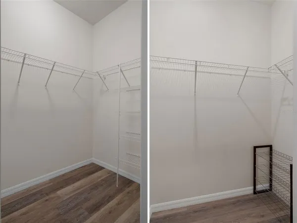 a view of a room with wooden floor