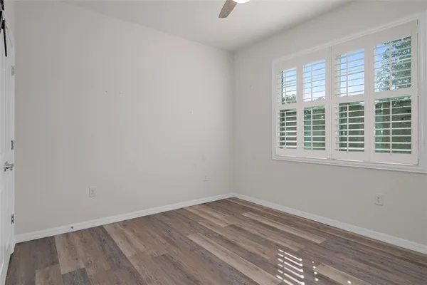 wooden floor and window in an empty room