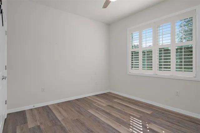 wooden floor and window in an empty room