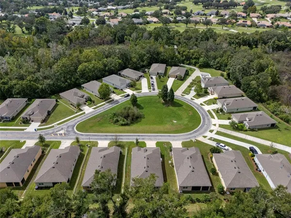 an aerial view of a house with outdoor space