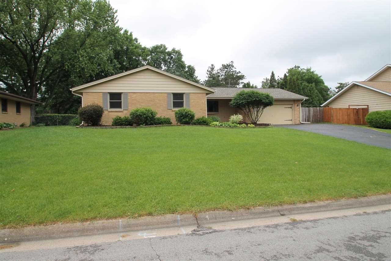 4961 Welsh Road Rockford, IL 61107 - Photo 1 of 19 a front view of house with yard and green space