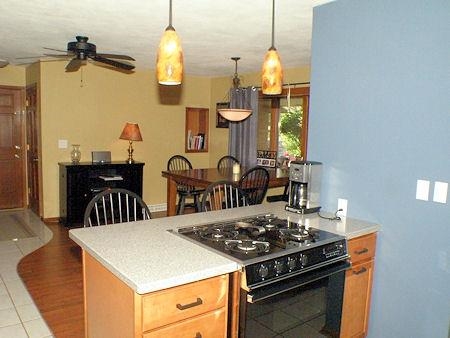 4961 Welsh Road Rockford, IL 61107 - Photo 3 of 19 a kitchen with a stove and a chandelier
