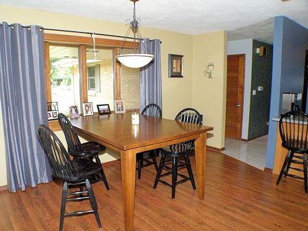 4961 Welsh Road Rockford, IL 61107 - Photo 6 of 19 a view of a dining room with furniture and wooden floor