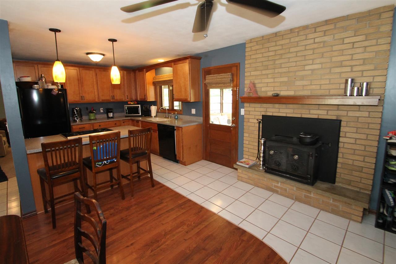 4961 Welsh Road Rockford, IL 61107 - Photo 8 of 19 a kitchen with stainless steel appliances granite countertop a stove a sink and a refrigerator