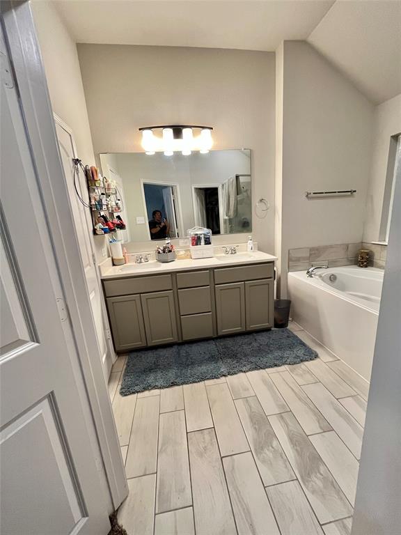 3128 Risinger Road Lorena, TX 76655 - Photo 11 of 14 a bathroom with a tub sink and mirror