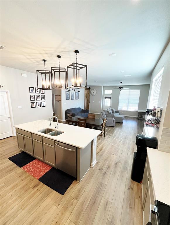 3128 Risinger Road Lorena, TX 76655 - Photo 14 of 14 a view of a kitchen with kitchen island wooden floors and stainless steel appliances