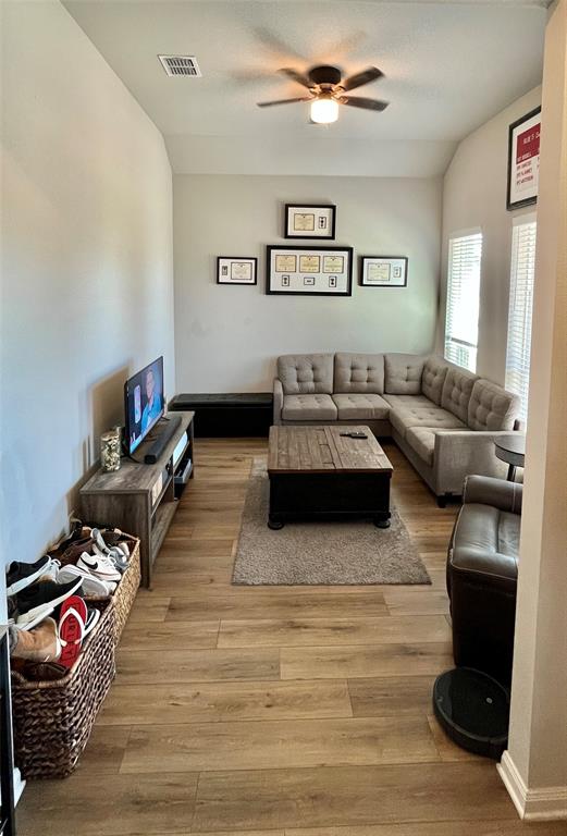 3128 Risinger Road Lorena, TX 76655 - Photo 7 of 14 a living room with furniture and wooden floor