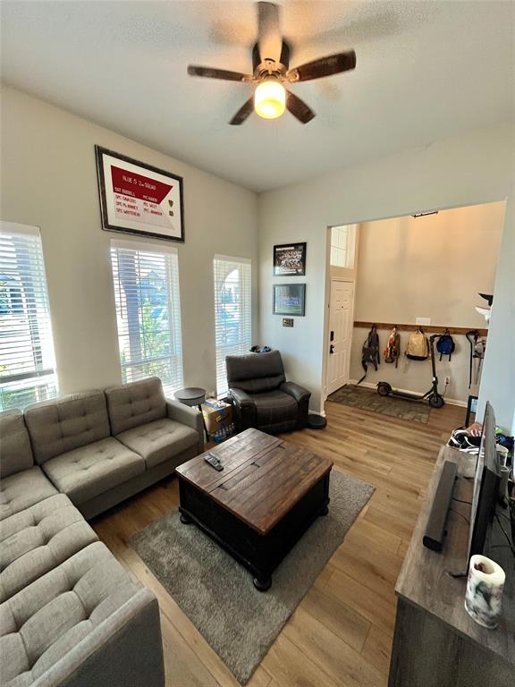 3128 Risinger Road Lorena, TX 76655 - Photo 8 of 14 a living room with furniture and a flat screen tv