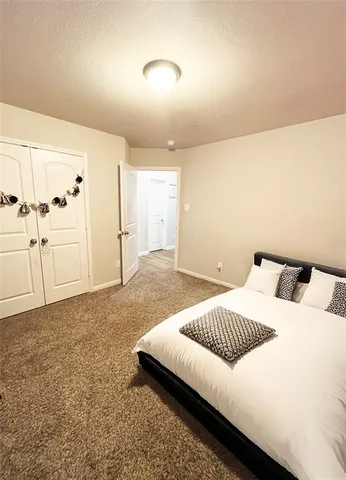 a bedroom with a bed and a cabinets