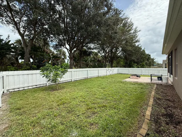 a view of backyard with green space