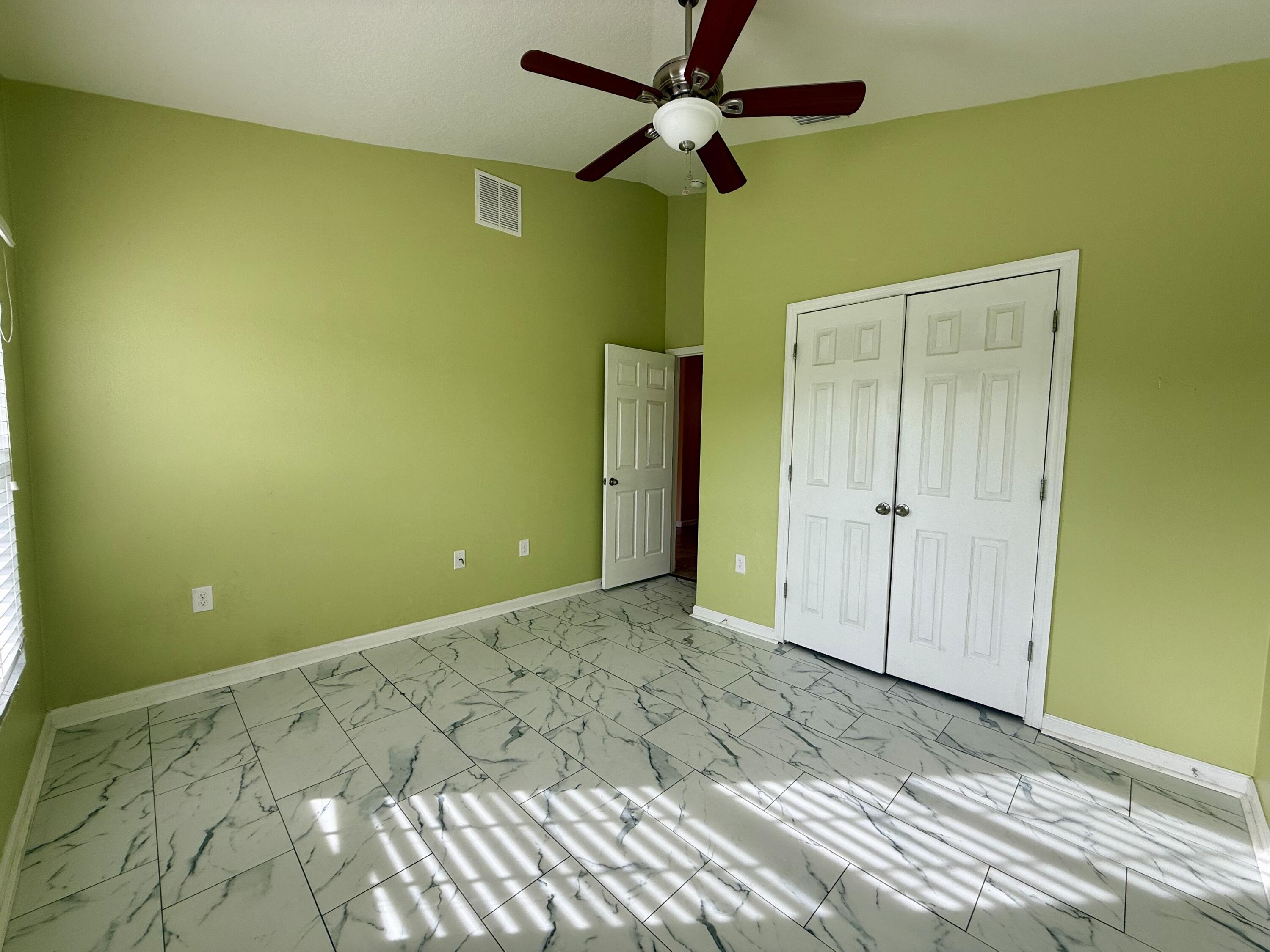 5997 Ridge Lake Circle Vero Beach, FL 32967 - Photo 7 of 14 a view of a big room with wooden floor