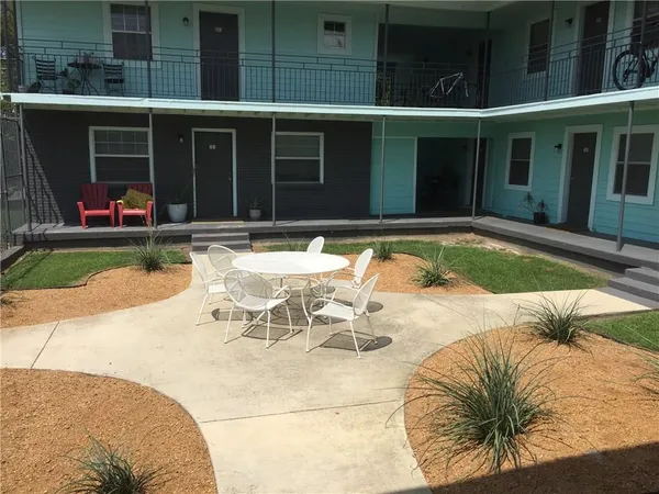 a view of a swimming pool with a lounge chair