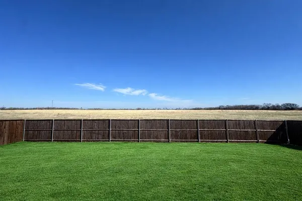 a view of outdoor space with backyard and porch