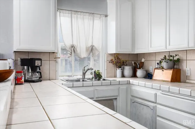 a view of a hallway view with wooden floor and staircase