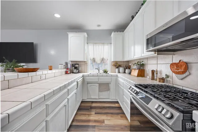 an empty room with closet and fan
