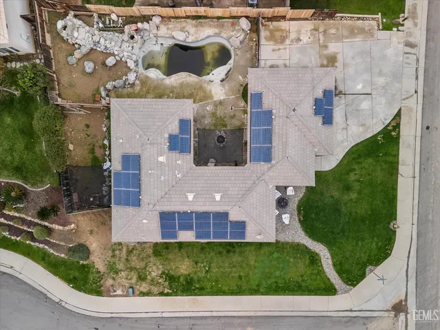 an aerial view of a house with garden