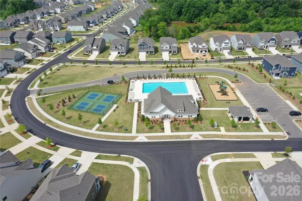 a view of a swimming pool with a yard