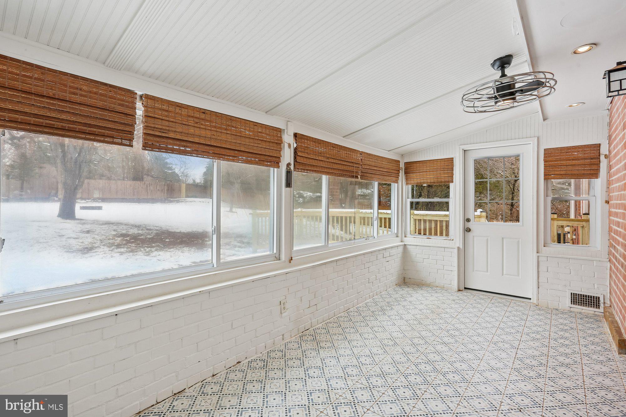 513 Beaumont Road Silver Spring, MD 20904 - Photo 37 of 58 Sunroom. Door to the Deck