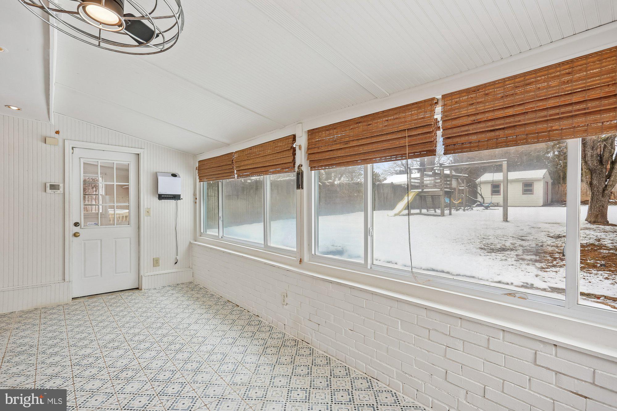 513 Beaumont Road Silver Spring, MD 20904 - Photo 38 of 58 Sunroom. Heater to the Right of the Door