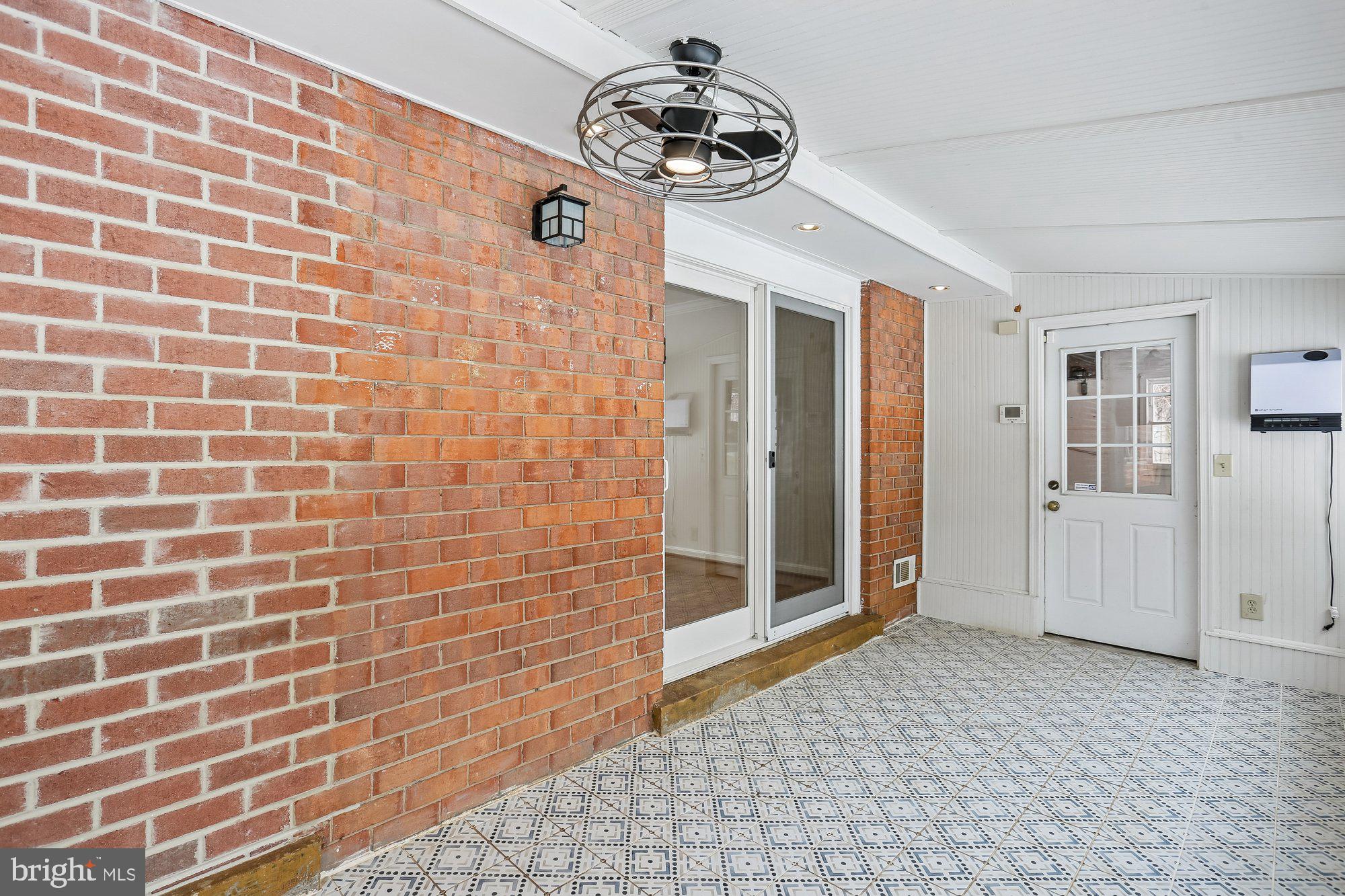513 Beaumont Road Silver Spring, MD 20904 - Photo 39 of 58 Sunroom. Sliding Glass Door to Kitchen/Living Area
