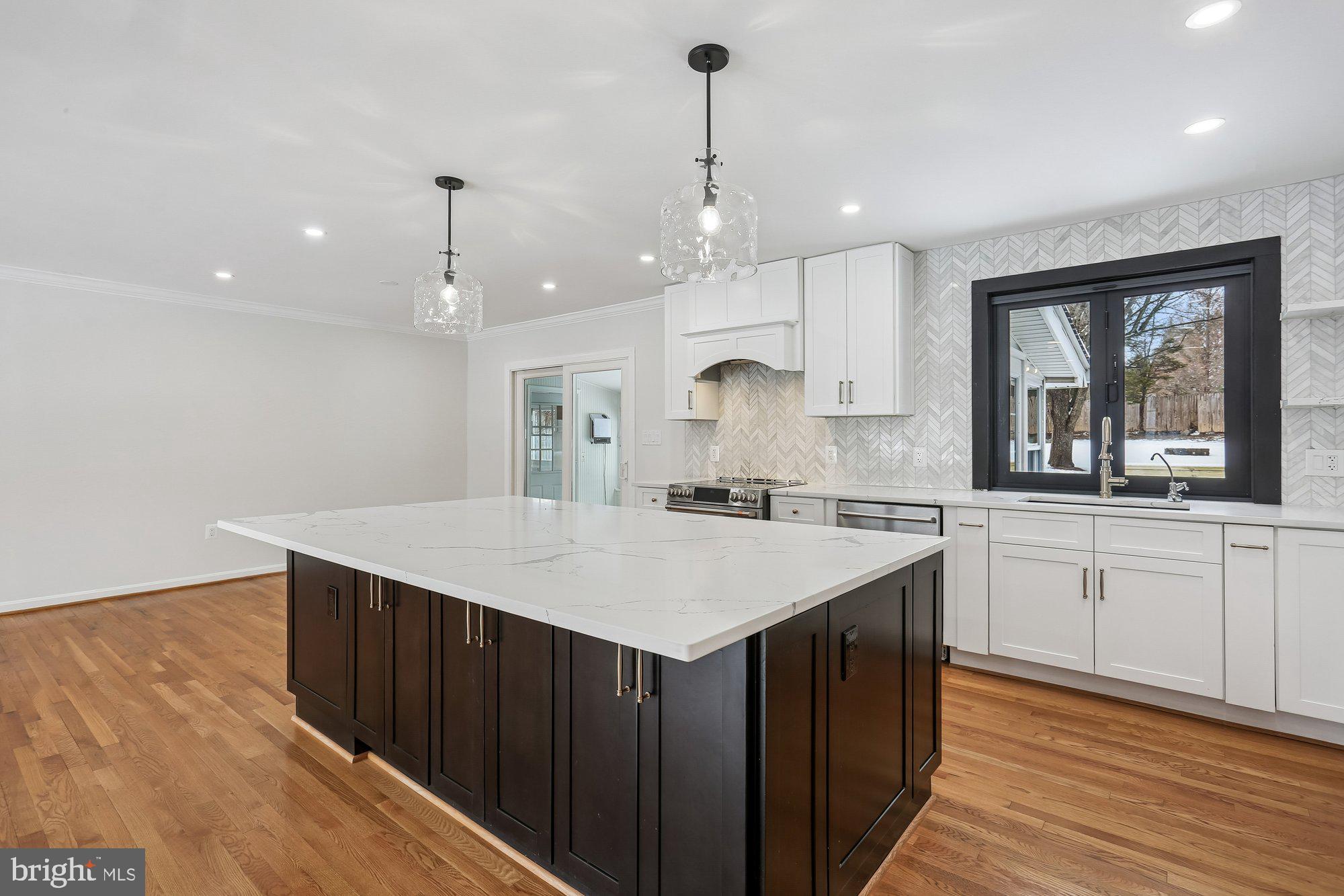 513 Beaumont Road Silver Spring, MD 20904 - Photo 10 of 58 Kitchen Island. Note the Bifold Window to Deck