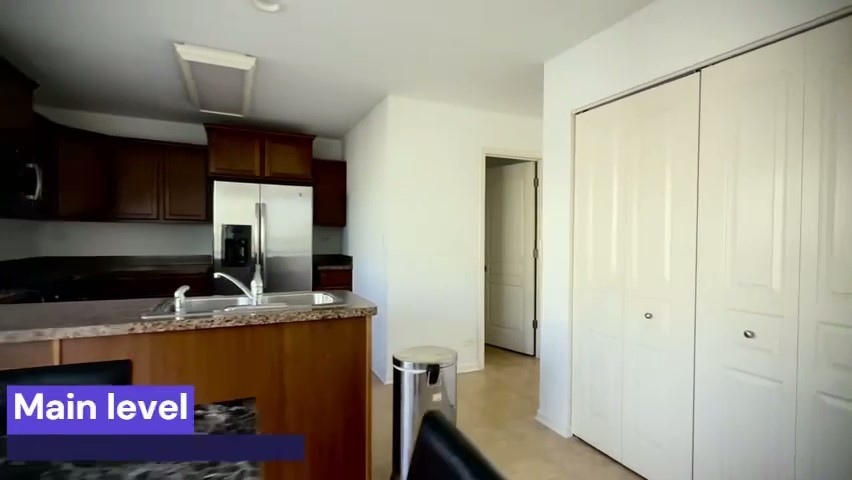 1192 Alta Vista Drive, Unit 1192 Pingree Grove, IL 60140 - Photo 4 of 8 a kitchen with stainless steel appliances granite countertop a refrigerator and a sink