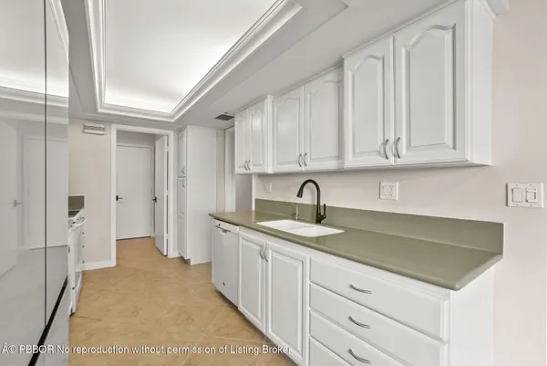 a kitchen with a sink and cabinets