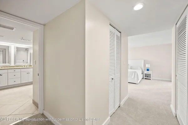 a view of a bathroom with sink and mirror