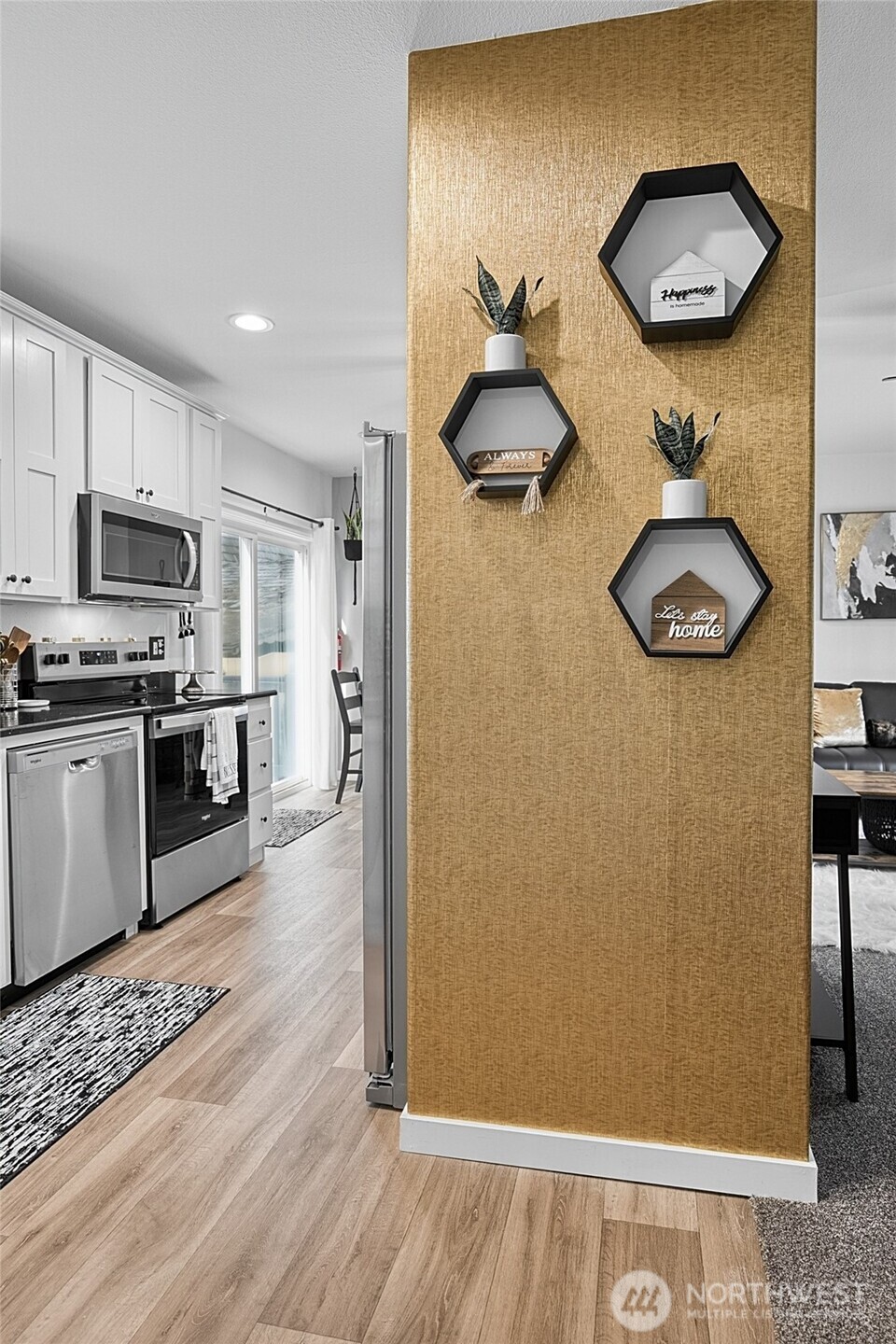 47295 State Route 109 Moclips, WA 98562 - Photo 21 of 40 a kitchen with stainless steel appliances granite countertop a refrigerator a stove and a wooden floors