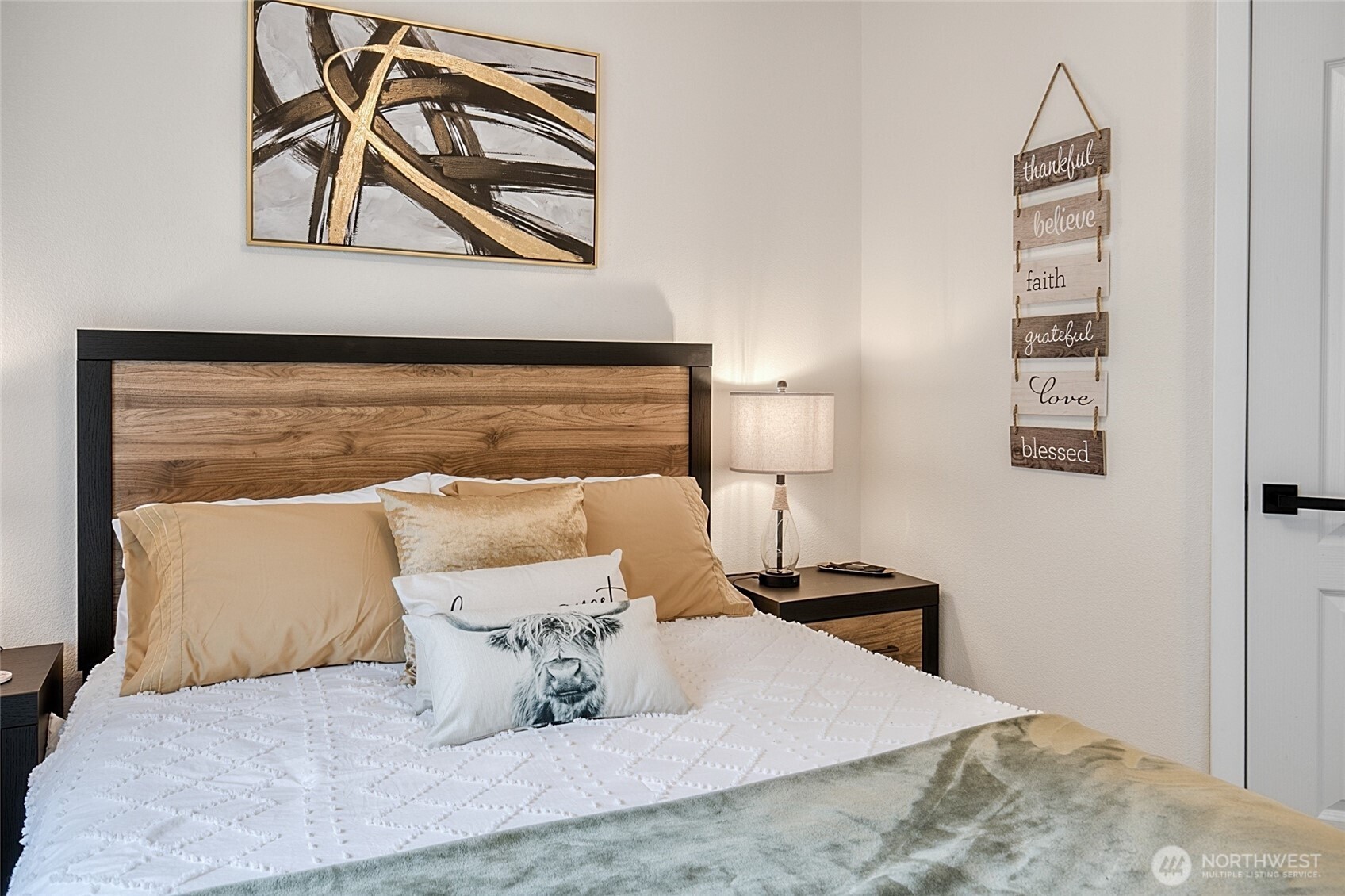 47295 State Route 109 Moclips, WA 98562 - Photo 26 of 40 a bed sitting in a bedroom next to a lamp
