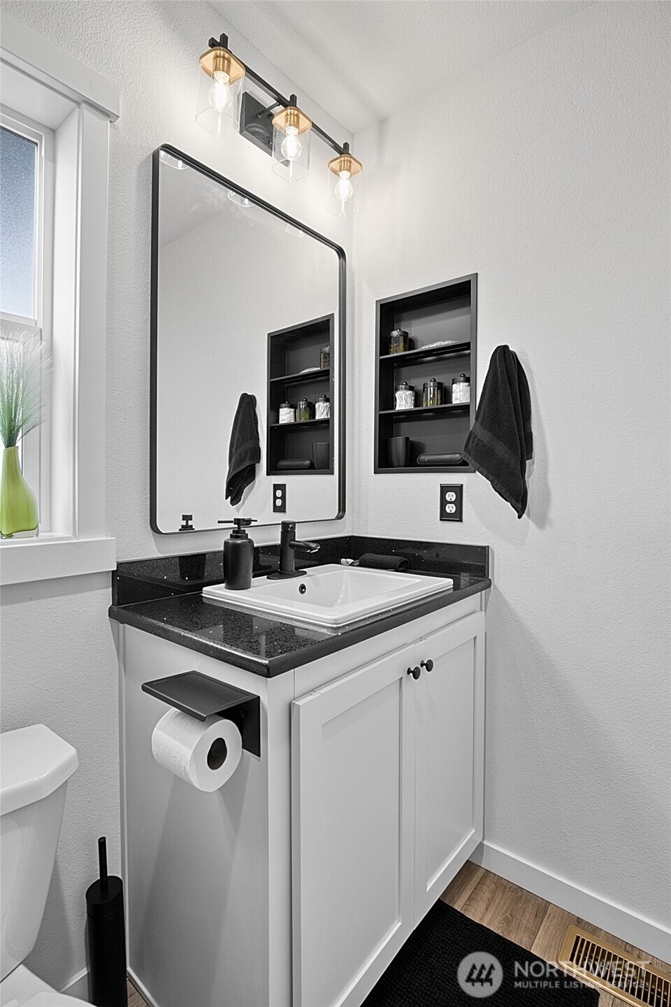 47295 State Route 109 Moclips, WA 98562 - Photo 28 of 40 a bathroom with a granite countertop sink a toilet and a mirror