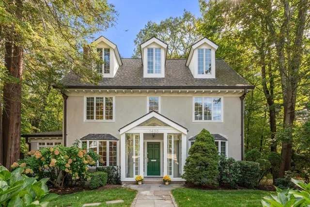 front view of a house with a yard