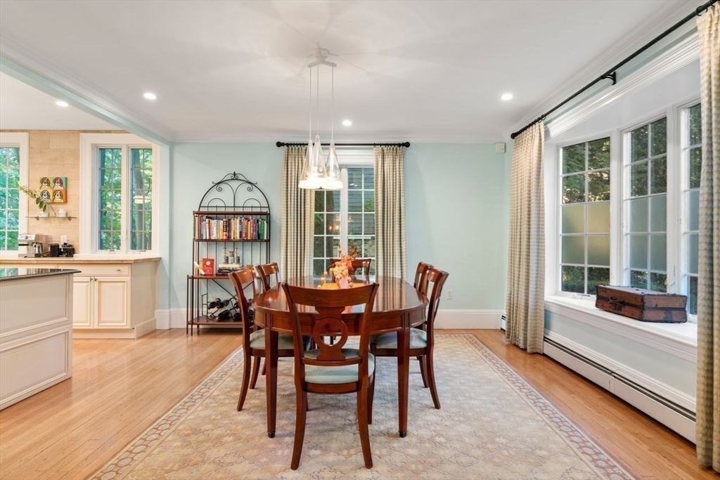 1430 Beacon Street Newton, MA 02468 - Photo 12 of 38 a view of a dining room with furniture large windows and wooden floor