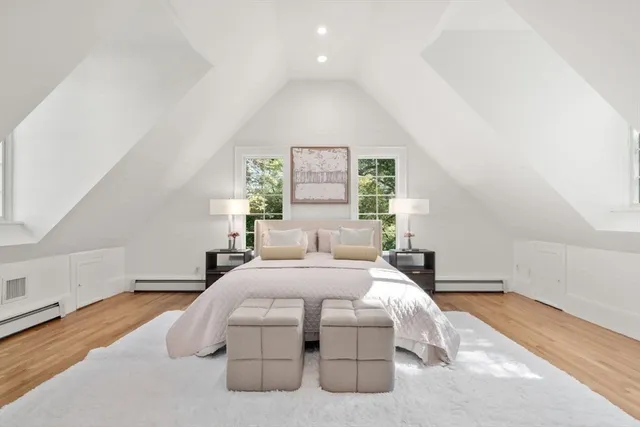 a bedroom with a bed and a night stand