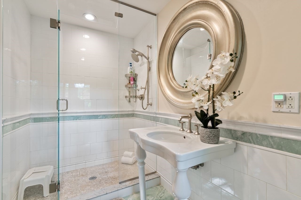 1430 Beacon Street Newton, MA 02468 - Photo 23 of 38 a bathroom with a sink and a mirror