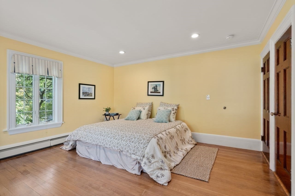 1430 Beacon Street Newton, MA 02468 - Photo 24 of 38 a bedroom with a large bed and a large window