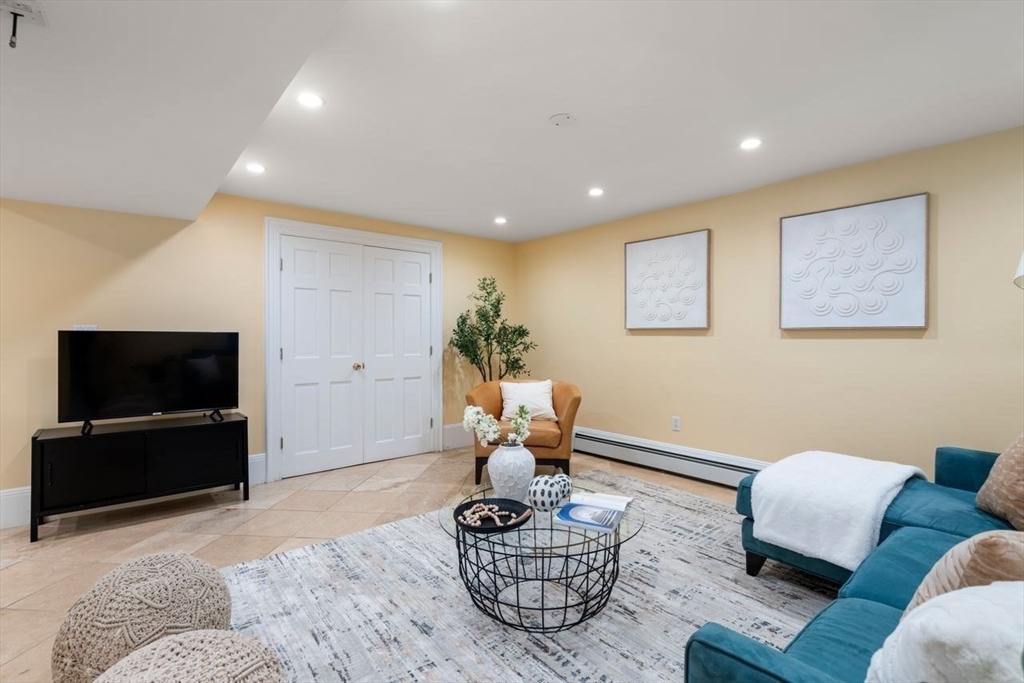 1430 Beacon Street Newton, MA 02468 - Photo 30 of 38 a living room with furniture and a flat screen tv