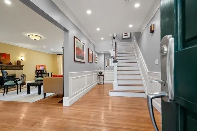 a view of entryway and dining room with furniture