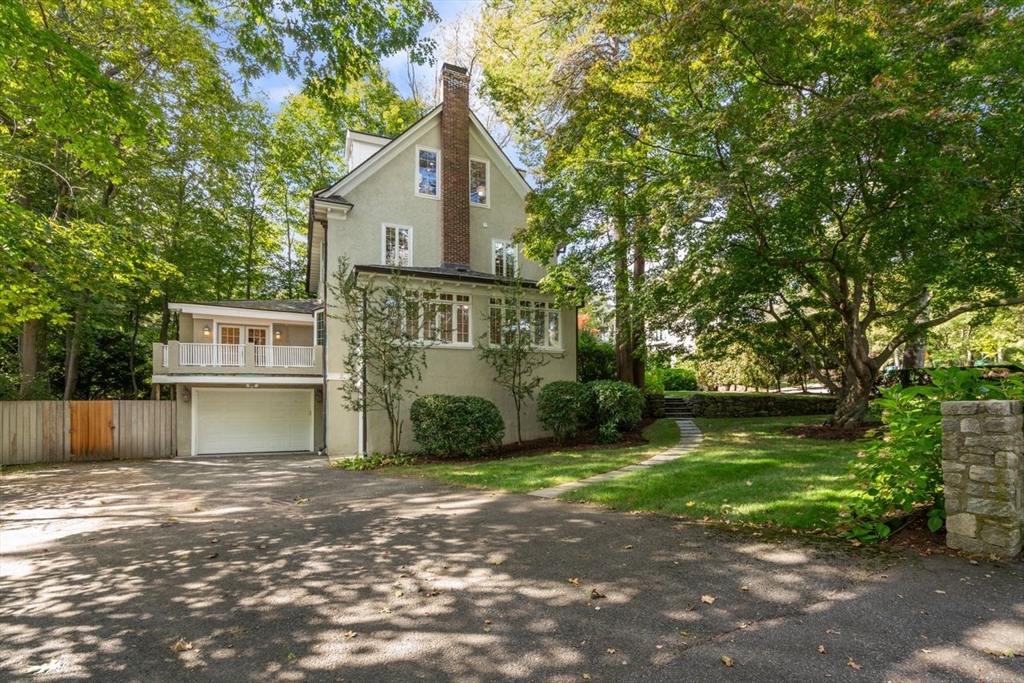 1430 Beacon Street Newton, MA 02468 - Photo 34 of 38 a front view of a house with a yard and garage